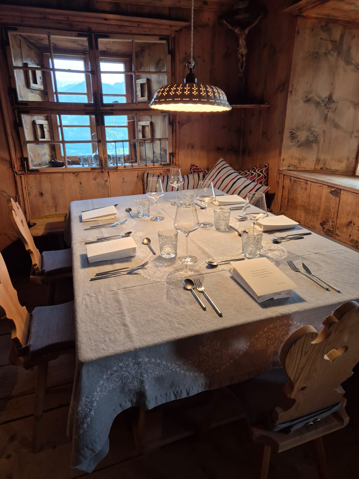 A table set for a private dinner in a wood-panelled room