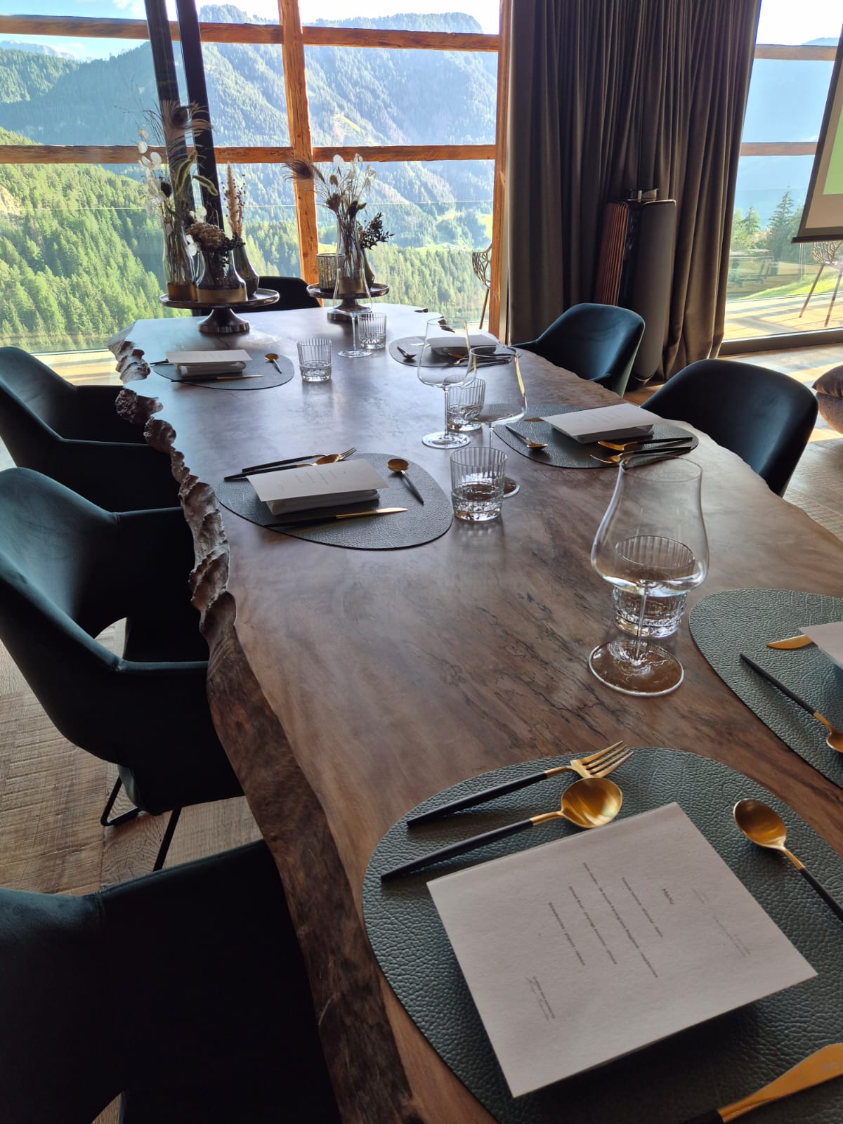 A table for a private chalet dinner overlooking the mountains